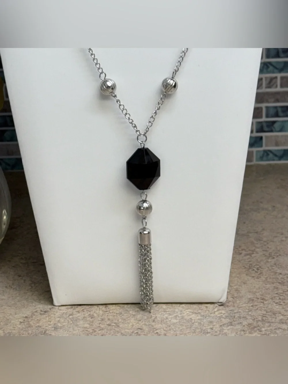 Silver and black y-style tassel necklace